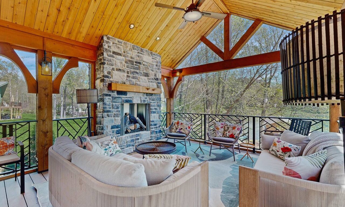 Bumpass House | Tranquil lakefront retreat with hot tub, screened porch, kayaks, and more