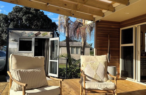 Taupo Bay House | All Decked Out in Beautiful Taupo Bay 2 minute walk to beach and Kids playground