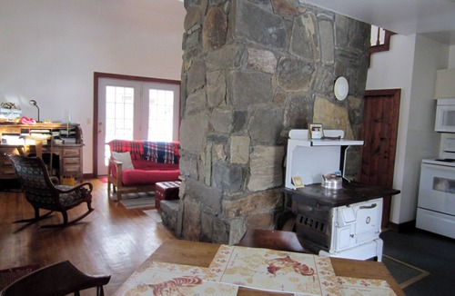 Plumtree Cabin | Classic mountain cabin with beautiful stone fireplace in a rural setting