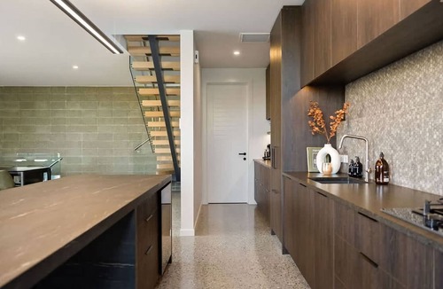 Frankton House | Elevated Elegance is a luxury retreat with dramatic views of the lake & mountains.