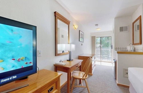 West End Cabin | Main Street studio - pool & hot tub - walk to lifts, dog-friendly, balcony
