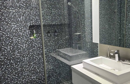 Patong Resort | Modern Studio Condo with access to gym and infinity pools.