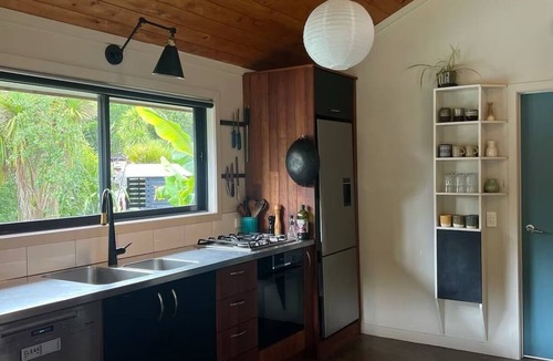 Raglan House | Relax & Unwind at Wainui Creek Retreat a private & tranquil home near the beach