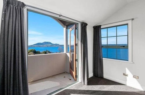 Acacia Bay House | Stunning Lake Views with spa pool, located in Acacia Bay with panoramic views. Wood burner for cooler days. Table tennis table to keep you entertained.