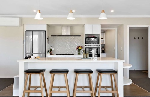 Kawarau Falls House | Urban Elegance is nestled in a peaceful neighbourhood - a perfect haven for relaxation.