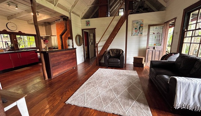 Hidden among lush rainforest and towering palms, a charming family retreat