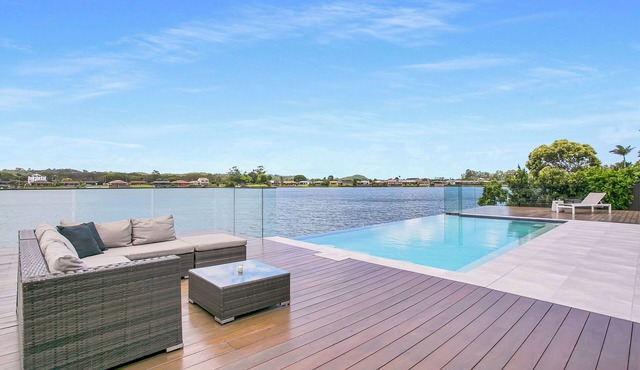 Waterfront Retreat with Infinity Pool & Canal Views