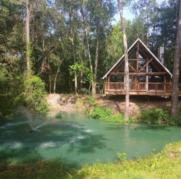 Waterfront Texas Cabin in a Magical Forest Resort in Plantersville